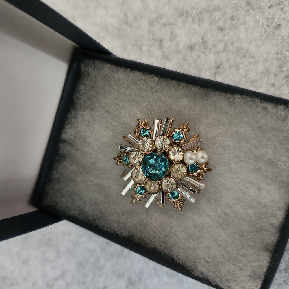 Elegant Gold and Blue Brooch